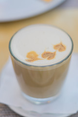 close up of vanilla raf coffee in transparent glass. Tasty hot drink. Soft focus