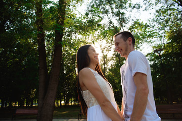 Fototapeta premium A beautiful couple is resting outside the city. Love story