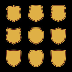 Shield shape gold icons set. Simple flat logo on black background. Symbol of security, protection, safety, strong. Element badge for protect design emblem decoration. Vector illustration