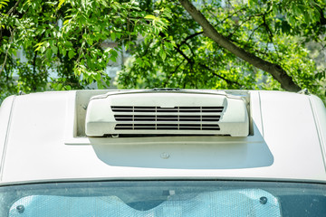 Cargo van air conditioner on the vehicle for cooling the goods inside close up