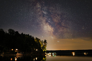The Milky Way at night over Walloon Lake in Northern Michigan, USA. - obrazy, fototapety, plakaty
