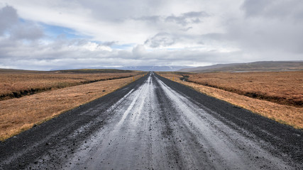 Fototapeta na wymiar Ring road in Iceland. Panorama with wide angle to the infinite distance in backgroud. Road with clouds.