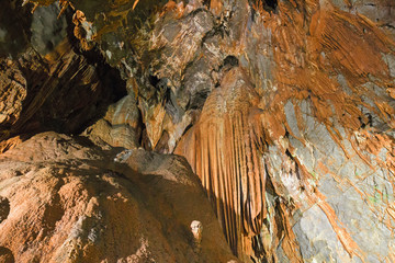 Rock formations of stalactites and stalagmites inside the cave of 