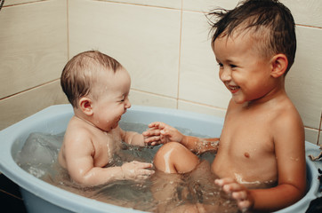 children, brother and sister in the bathroom