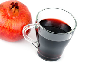 Glass of pomegranate juice with fruit isolated on white. Healthy food. Free space for text.