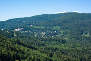 Fototapeta na wymiar Small town in the wild Carpathian mountains scenic view.