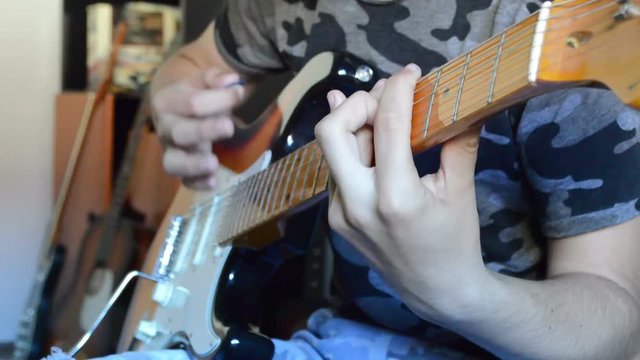 Young boy playing guitar