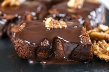 Chocolate raw vegan cake with nuts, figs and carob. Love for a healthy raw food concept.