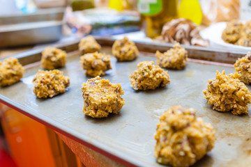 Raw Oatmeal Raisin Cookie Dough Balls on a Tray