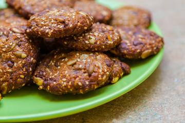 Plate of Baked Oatmeal Raisin Cookies with Nuts and Seeds