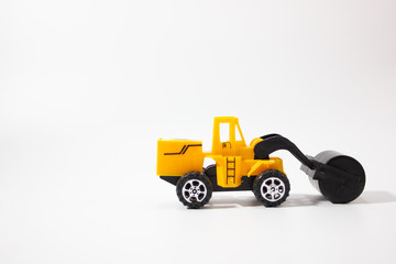 Miniature road roller isolated white background side view.