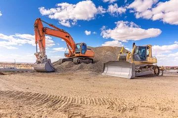 Fotobehang Vrachtwagen Group of excavator working on a construction site  © Enrique del Barrio