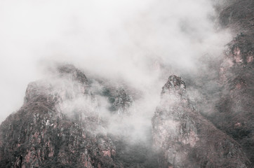 High mountains and rocks in the clouds