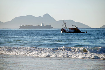 Fishing boat on Copacabana beach Rio de Janeiro