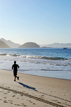 Man running on the Copacabana beach