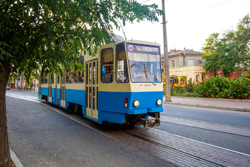 blue tram rides around the city