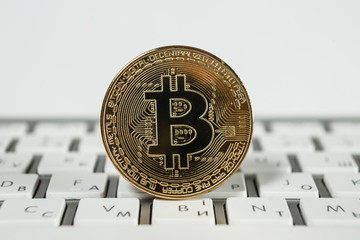 Golden bitcoin coin close up
