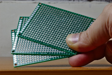 User holding three protoboards