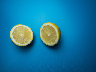 Fresh lemon isolated on blue background