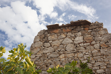 Fototapeta na wymiar walls of a ruined old stone house