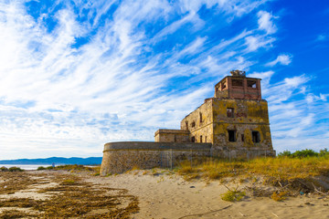 Fototapeta na wymiar The old coastal salt tower near Piombino in Tuscany, Italy