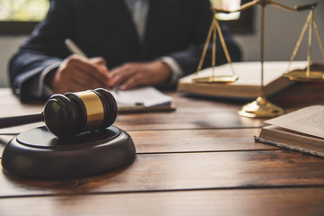 Law theme, mallet of the judge, law enforcement officers, evidence-based cases, and documents taken...