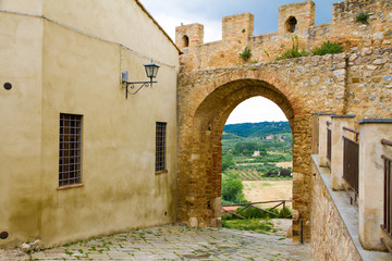 St. Martin gate in the town of Magliano in Toscana, Italy