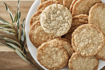 cookies on white plate and wooden background. Top view.
