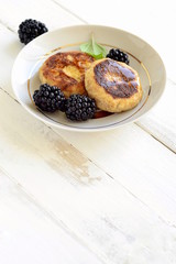Cottage cheese pancake with honey and blackberries, vertical , copy space