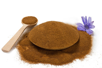 chicory in a wooden Cup isolated on white, top view