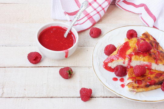 pieces of curd pudding with raspberry jam