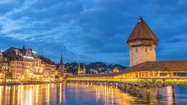 Lucerne city skyline day to night timelapse at Chapel Bridge, Lucerne (Luzern), Switzerland 4K Time lapse