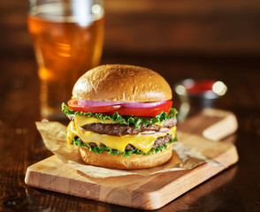 double cheese burger with beer - obrazy, fototapety, plakaty