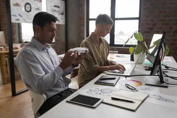 Business colleagues working at desk