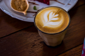 coffee cappucino cup and cake on wood table classic style in coffee shop