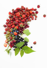 Strawberry, currant, gooseberry, cherry, raspberry on white background with leaves