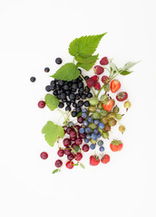 Strawberry, currant, gooseberry, cherry, raspberry on white background with leaves
