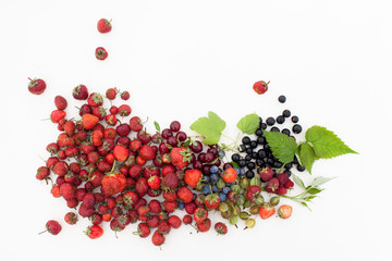 Strawberry, currant, gooseberry, cherry, raspberry on white background with leaves