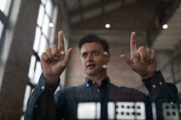 Businessman using an invisible screen