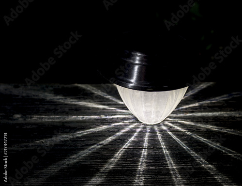Solar Garden Light Or Lantern In Evening Bright Rays On Solar Garden Light Or Lantern In Evening Bright Rays On Wooden Dark Background