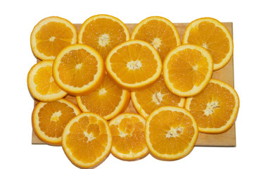 Sliced orange on a board isolated on white background.
