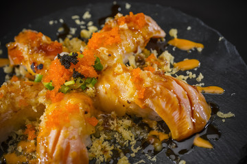 Salmon Nigiri, Sushi salmon burned and topped with Shrimp Eggs and Tempura, Japanese food style, Japanese Food menu, selective focus