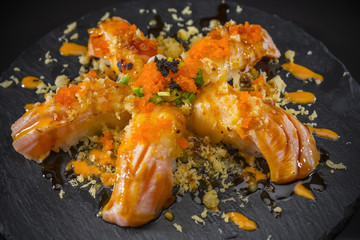 Salmon Nigiri, Sushi salmon burned and topped with Shrimp Eggs and Tempura, Japanese food style, Japanese Food menu, selective focus