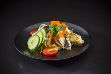 Crispy Salmon Salad topped with wakame and  Shrimp Eggs, Japanese food, fuision food, Salmon salad in Thai style, selective focus