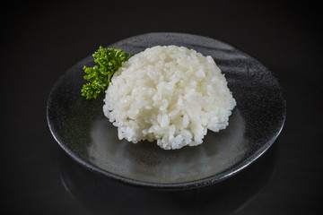 Japanese cuisine, steamed rice with on black background, Japanese food, Japanese dish