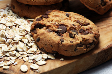 Chocolate cookies on rustic table. Chocolate chip cookies and cookies with oat flakes or oatmeal.
