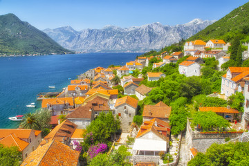 Fototapeta na wymiar Kotor, Montenegro. Bay of Kotor bay is one of the most beautiful places on Adriatic Sea, it boasts the preserved Venetian fortress, old tiny villages, medieval towns and scenic mountains.