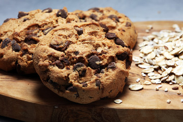 Chocolate cookies on rustic table. Chocolate chip cookies and cookies with oat flakes or oatmeal.