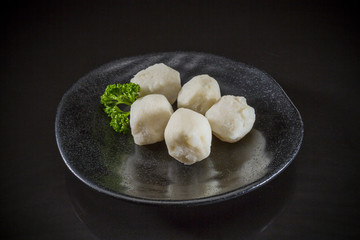 Shabu Asian food, fish ball on black background, Japanese and Chinese traditional food