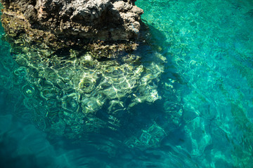 Fototapeta na wymiar Vivid blue sea in laguna and rock Turkey
